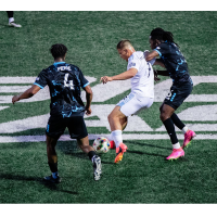 Colorado Springs Switchbacks FC's Delentz Pierre and Ronaldo Damus battle New York City FC II's Jovan Mijatović