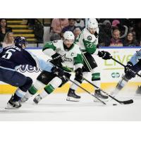 Texas Stars' Nick Caamano and Mavrik Bourque battle Milwaukee Admirals' Kevin Gravel