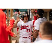 Juan Fernandez is congratulated by Fargo-Moorhead RedHawks teammates