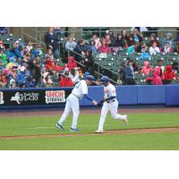 Yolmer Sanchez of the Syracuse Mets is congratulated while rounding the bases