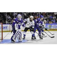 Syracuse Crunch's Matt Tomkins and Emil Lilleberg and Cleveland Monsters' Joshua Dunne on the ice