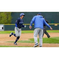 Marek Chlup celebrating his home run with Lake Country DockHounds Manager Ken Huckaby