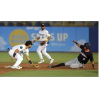 Biloxi Shuckers' Ethan Murray and Pensacola Blue Wahoos' Jorge Caballero in action