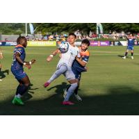 Lexington SC forward Cameron Lancaster (center) vs. One Knoxville SC