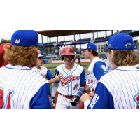 Sam Miller of the Green Bay Rockers is congratulated by teammates