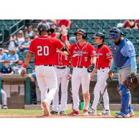 Fargo-Moorhead RedHawks exchange congratulations at the plate