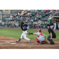 Tri-City Dust Devils first baseman Matt Coutney takes a big swing