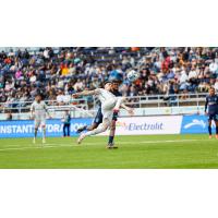 Oakland Roots go airborne for a ball against Monterey Bay FC