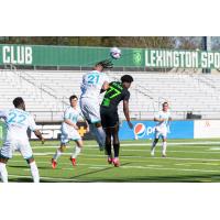 Lexington SC forward Nico Brown (77) fights for a header vs. Spokane Velocity FC