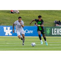 Lexington SC defender Modesto Mendez (right) vs. Greenville Triumph SC