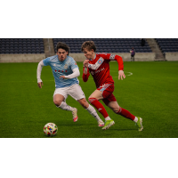 Chicago Fire Academy midfielder Vitaliy Hlyut (right)