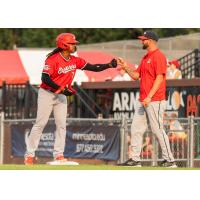 Sioux City Explorers' Osvaldo Martínez congratulated by coach Josh Hinz