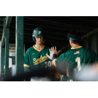 Sanford Mainers' Ed Sullivan congratulated by Mateo Hernandez