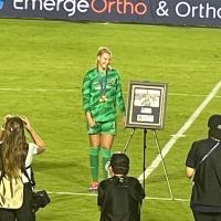 North Carolina Courage goalkeeper Casey Murphy with her gold medal