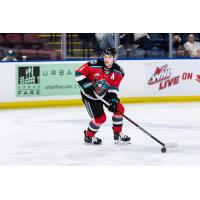 Caden Price handles the puck for the Kelowna Rockets