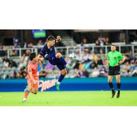 Louisville City FC goes high to corral a ball in the air