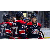 Saginaw Spirit exchange congratulations along the bench