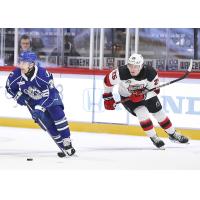 Syracuse Crunch forward Conor Sheary (left) vs. the Utica Comets