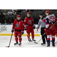 Kenny Johnson of the Allen Americans (right) addresses the Rapid City Rush