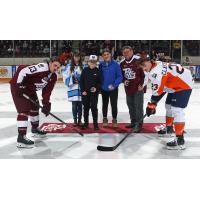 Peterborough Petes centre Gavin Bryant (left) during the ceremonial faceoff vs. the Flint Firebirds