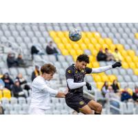 Pittsburgh Riverhounds go up for a header against Duquesne University