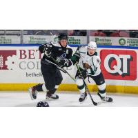 Wichita Thunder forward Peter Bates (left) vs. the Utah Grizzlies