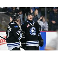 Wenatchee Wild forward Shaun Rios (right) exhales after scoring one of his two goals