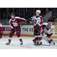 Peterborough Petes defenceman Carson Cameron (left) vs. the Ottawa 67's