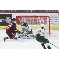 Jared Dmytriw of the Vancouver Giants presses Everett Silvertips goaltender Dustin Wolf