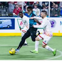 St. Louis Ambush forward Jerjer Gibson splits the Kansas City Comets defense