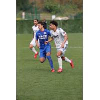 Tajon Buchanan (center) and Edgar Castillo (rear) of the New England Revolution vs. Shanghai Shenhua