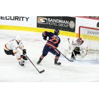 Kamloops Blazers' Vít Záhejský battles Vancouver Giants' Colton Alain and Burke Hood