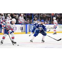 Rochester Americans' Erik Brännström and Syracuse Crunch's Conor Sheary on the ice
