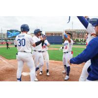 Jose Ramos celebrates with Tulsa Drillers teammates